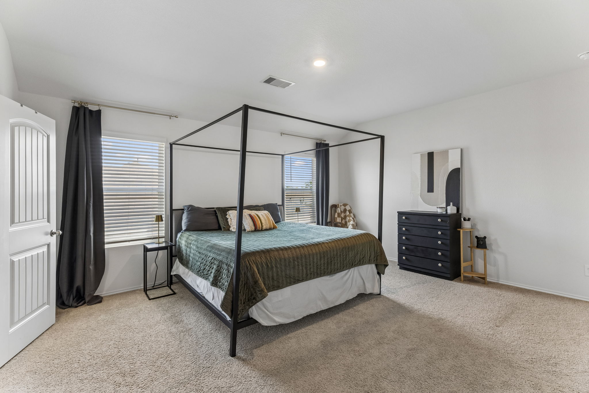 343 Sickle Loop Kyle, TX 78640 - Photo 23 of 40 Spacious bedroom featuring neutral carpeting and white walls