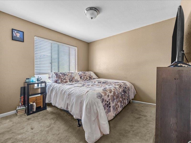 2860 B B 3/4 Road Grand Junction, CO 81503 - Photo 23 of 29 a bedroom with a bed and a flat screen tv