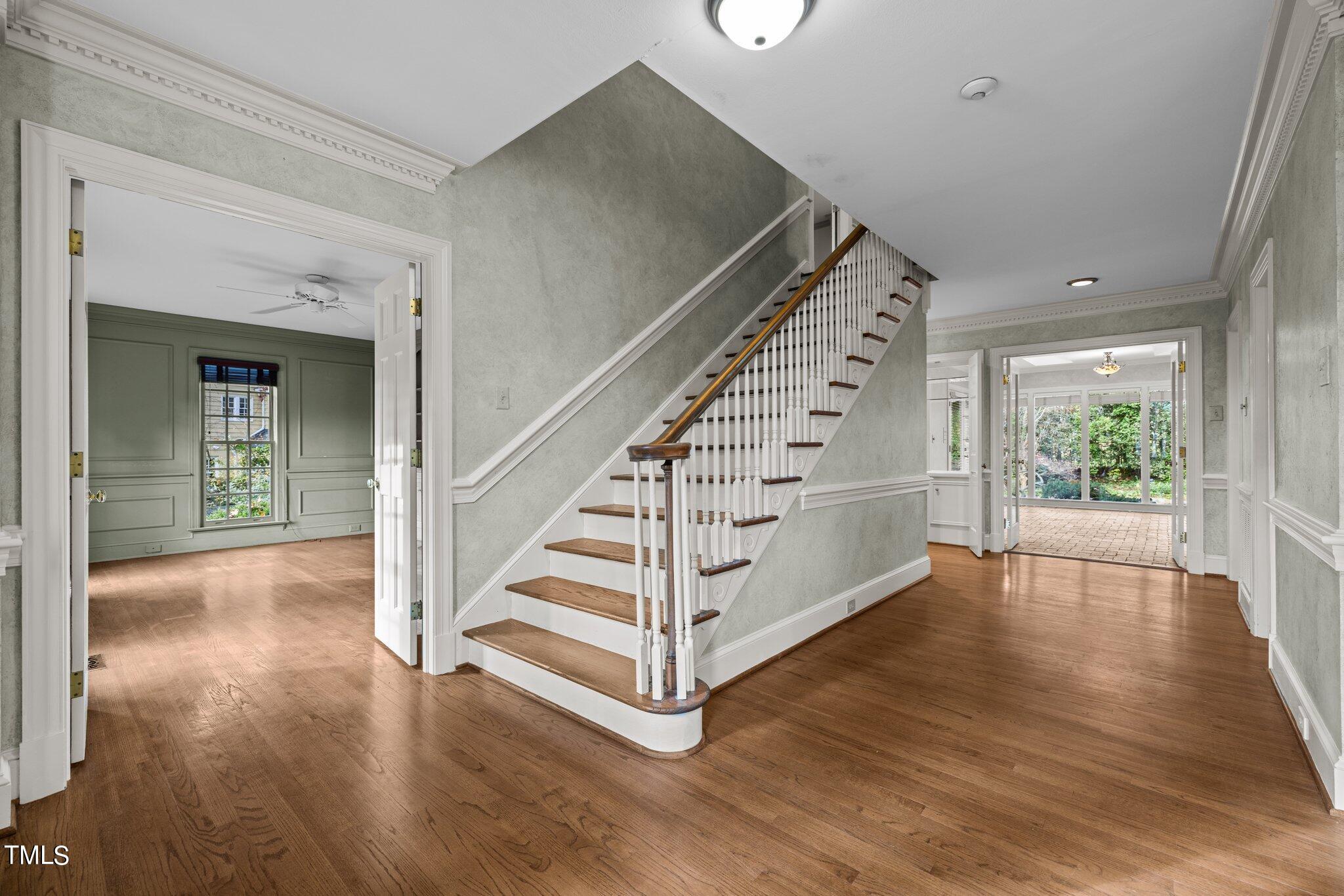 3608 Dover Road Durham, NC 27707 - Photo 12 of 58 a view of entryway with wooden floor and stairs