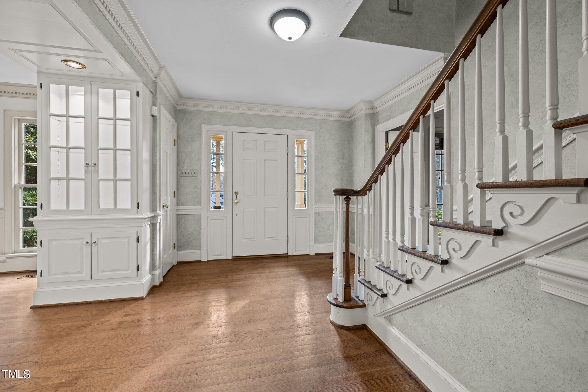3608 Dover Road Durham, NC 27707 - Photo 13 of 58 a view of an entryway with wooden floor and staircase
