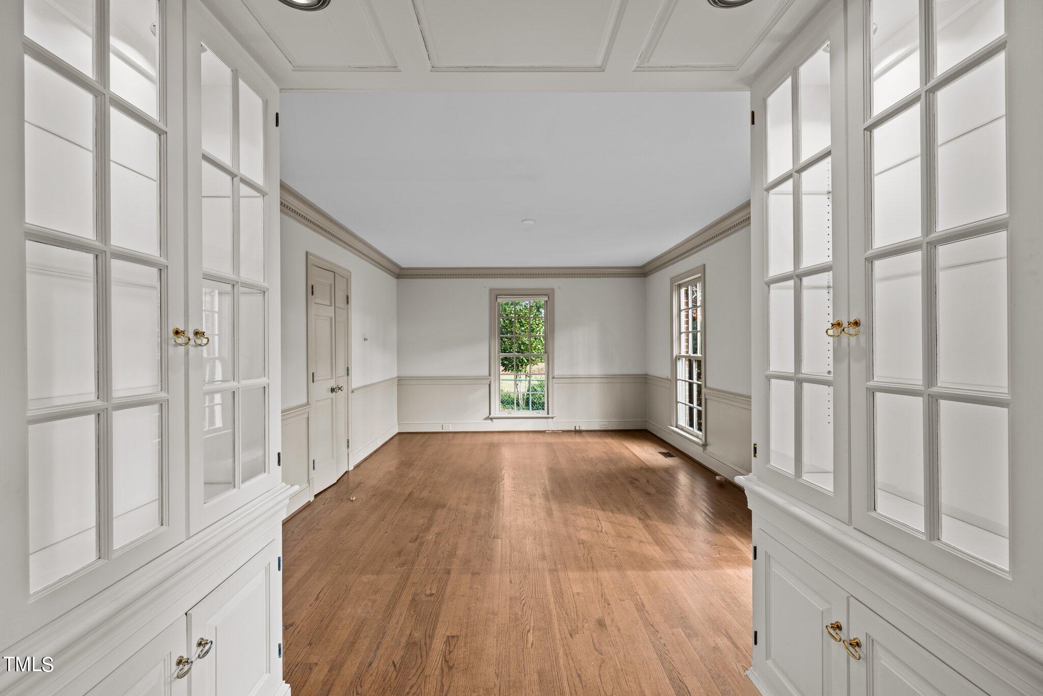 3608 Dover Road Durham, NC 27707 - Photo 14 of 58 a view of an empty room with wooden floor and a window