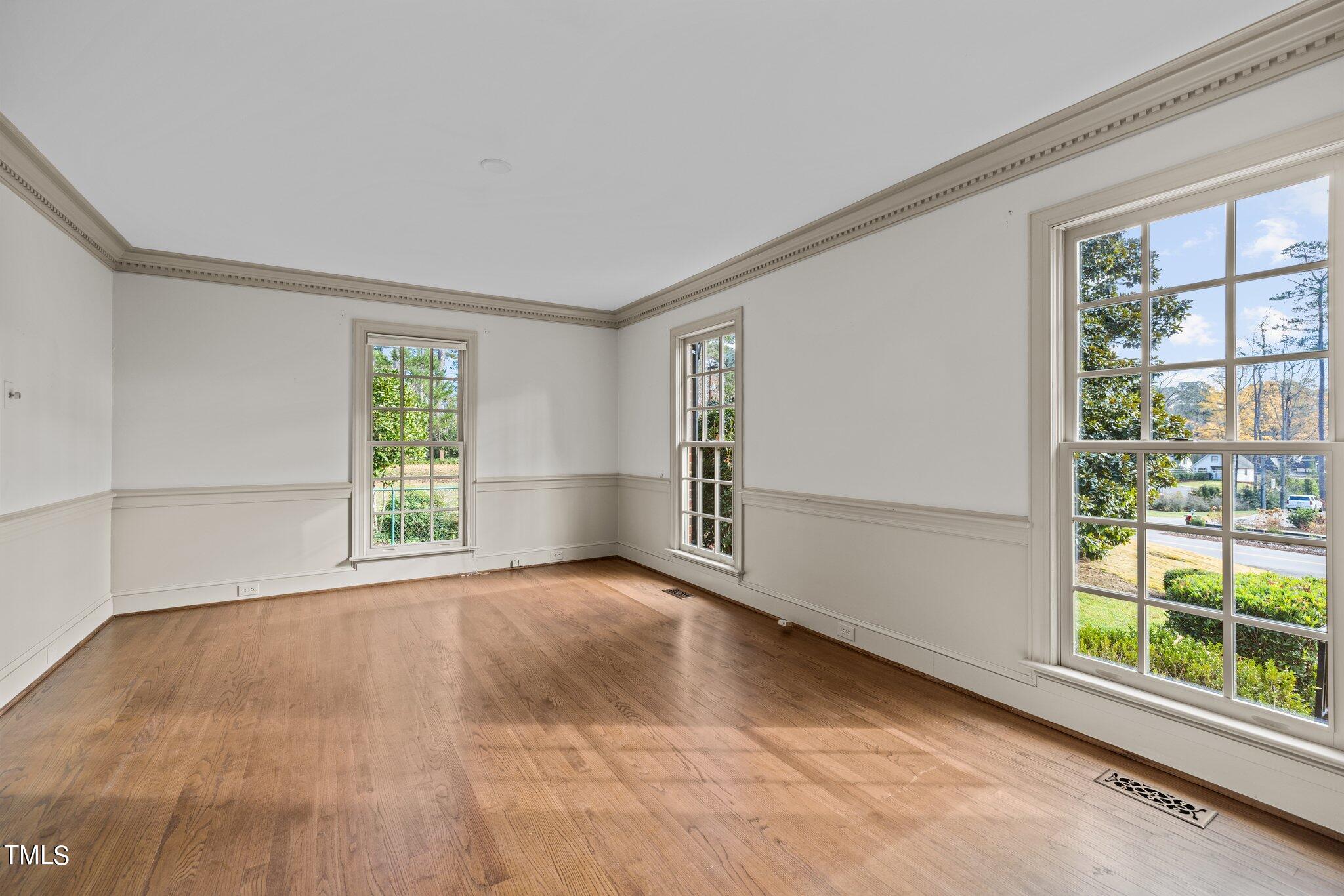 3608 Dover Road Durham, NC 27707 - Photo 16 of 58 a view of an empty room with a window