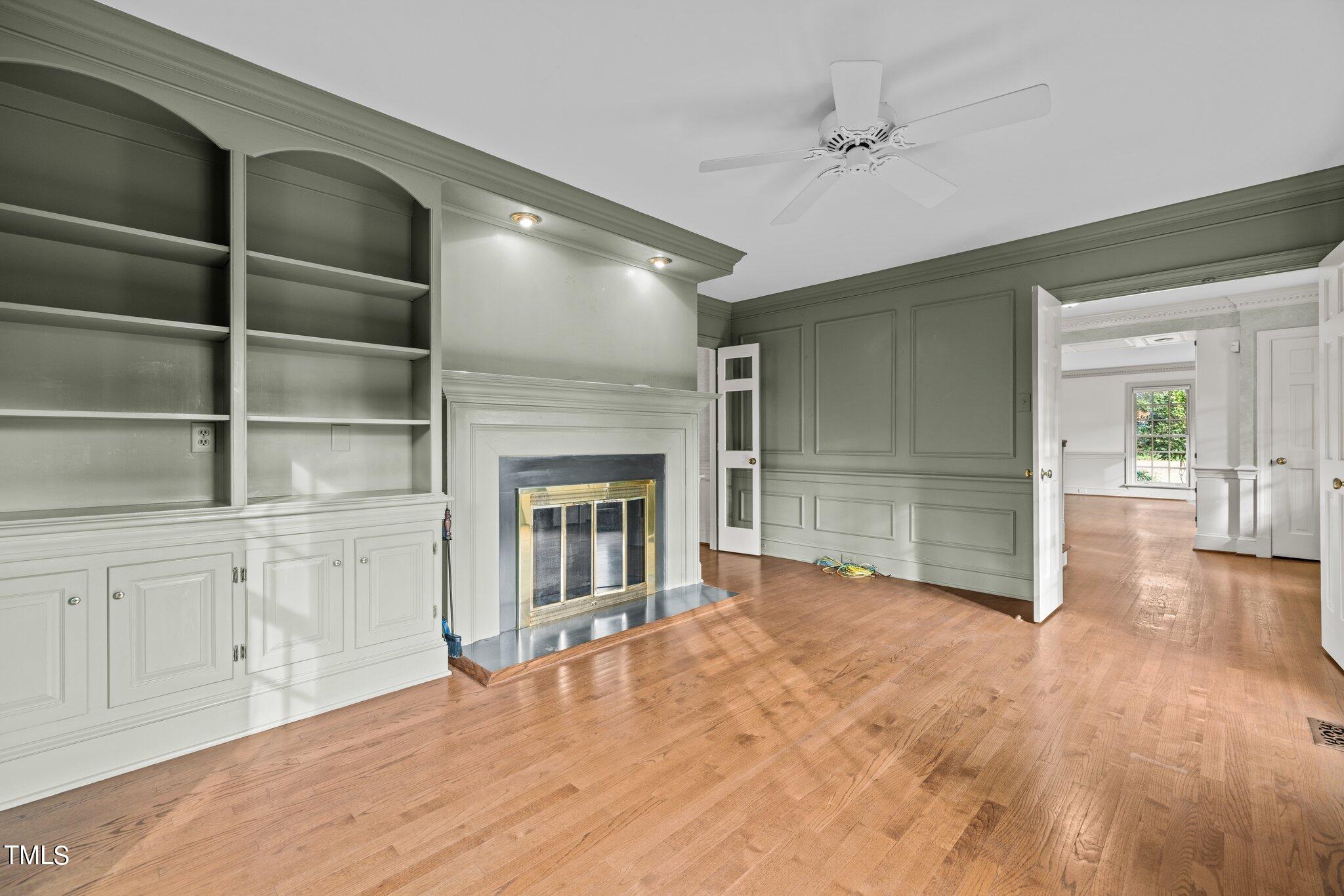 3608 Dover Road Durham, NC 27707 - Photo 18 of 58 a view of empty room with cabinet and a fireplace