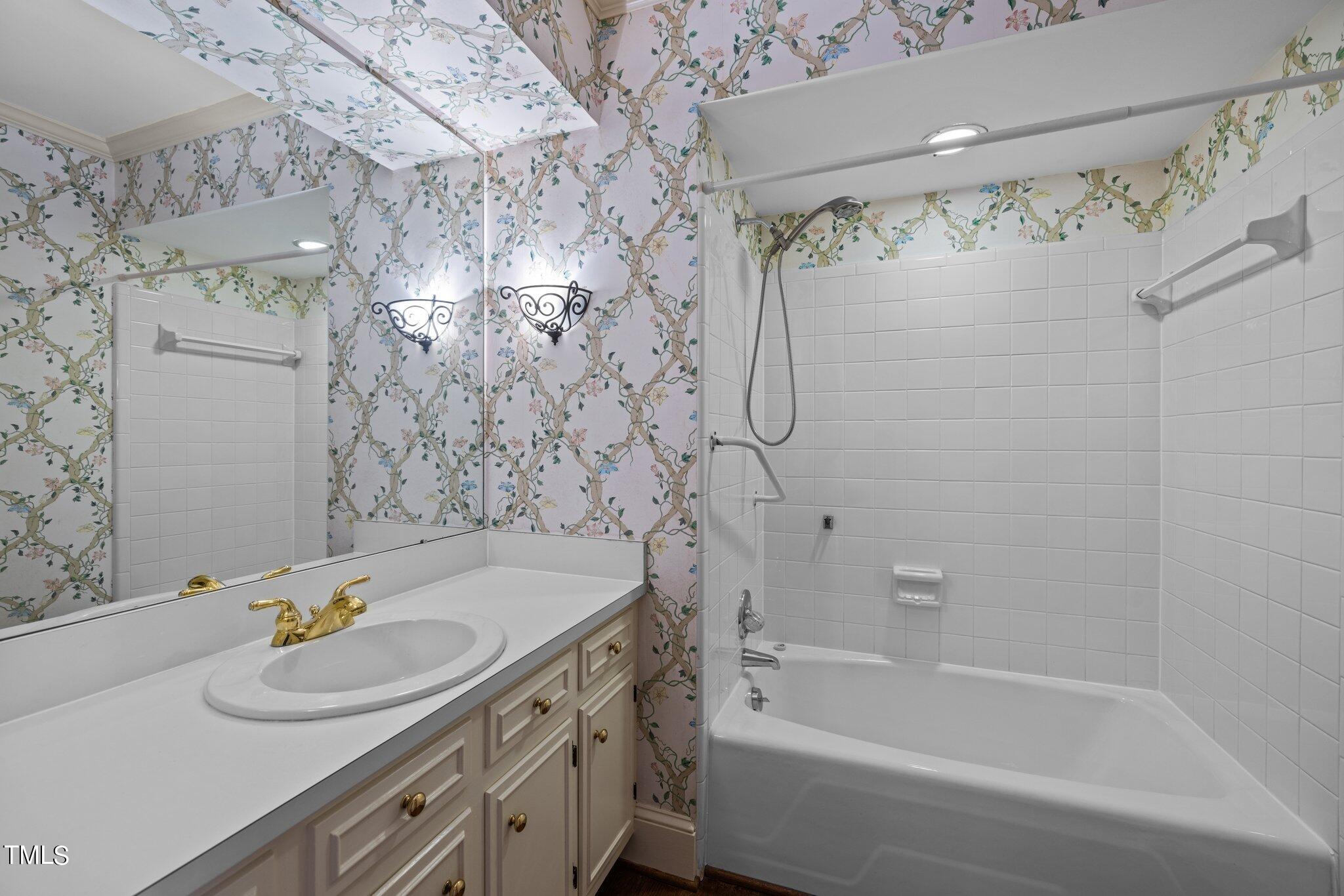 3608 Dover Road Durham, NC 27707 - Photo 23 of 58 a bathroom with a sink and a bathtub