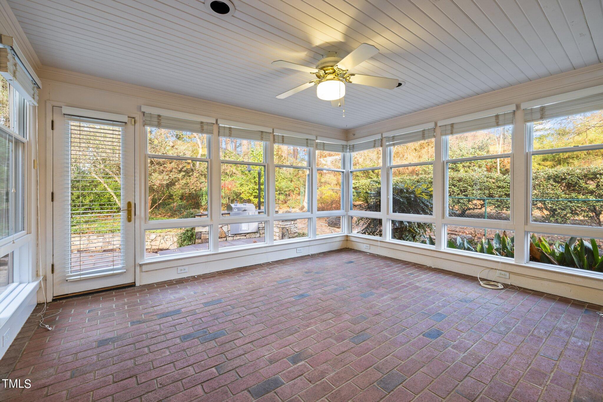 3608 Dover Road Durham, NC 27707 - Photo 29 of 58 a view of an empty room with wooden floor and a window