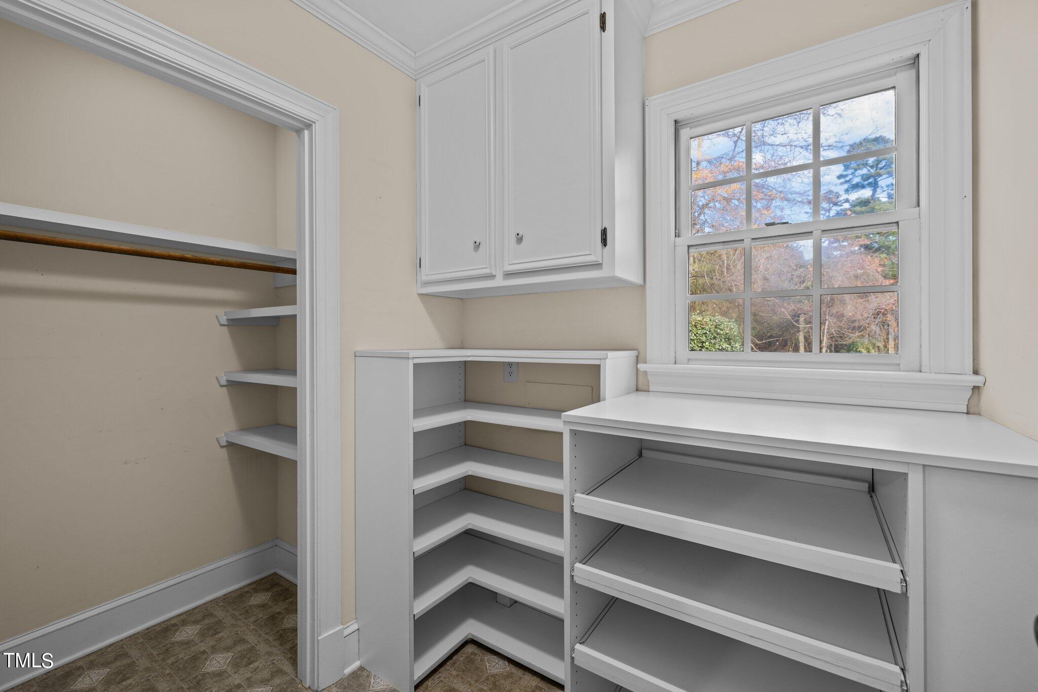 3608 Dover Road Durham, NC 27707 - Photo 32 of 58 a view of walk in closet with empty racks