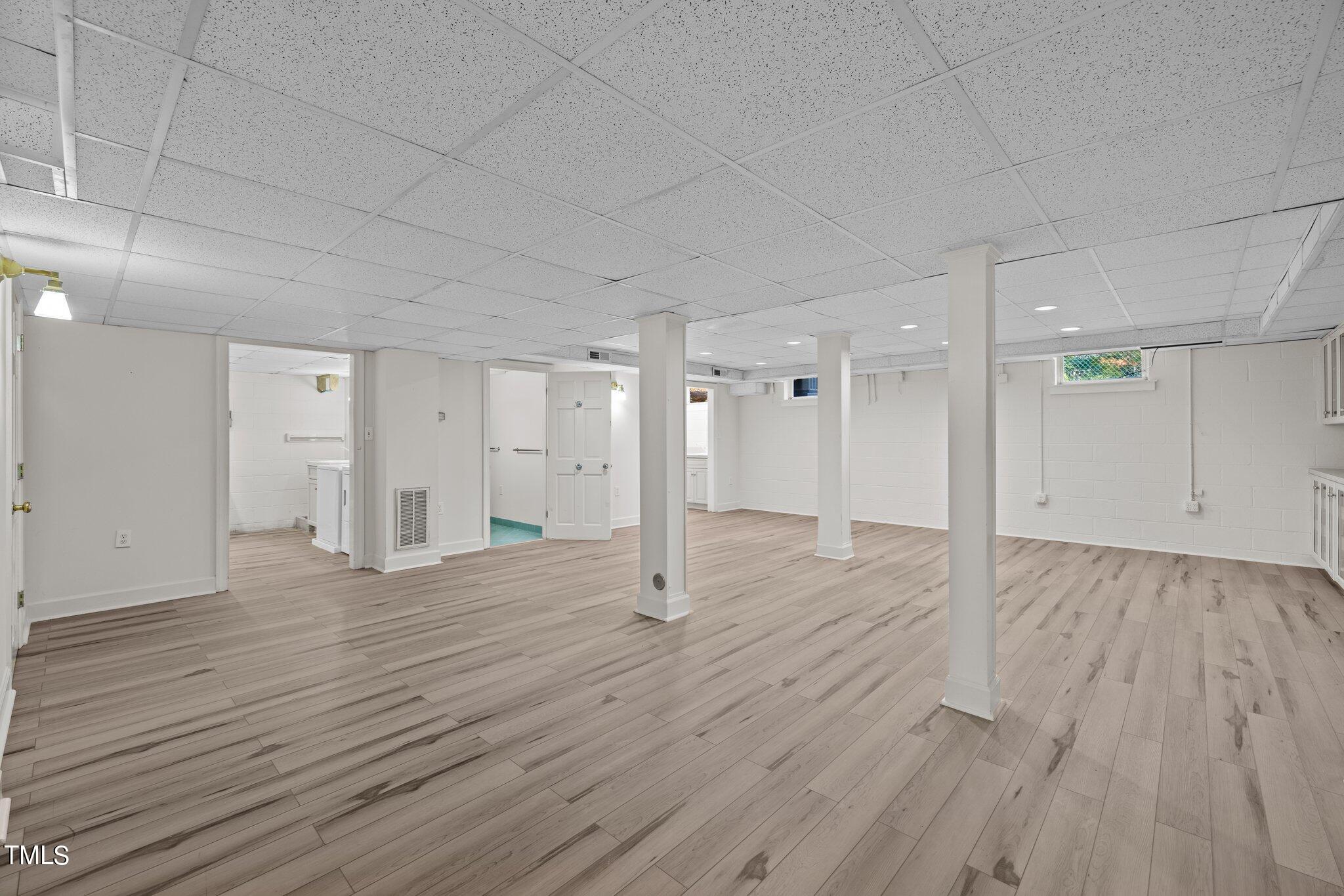 3608 Dover Road Durham, NC 27707 - Photo 50 of 58 a view of an empty room with wooden floor