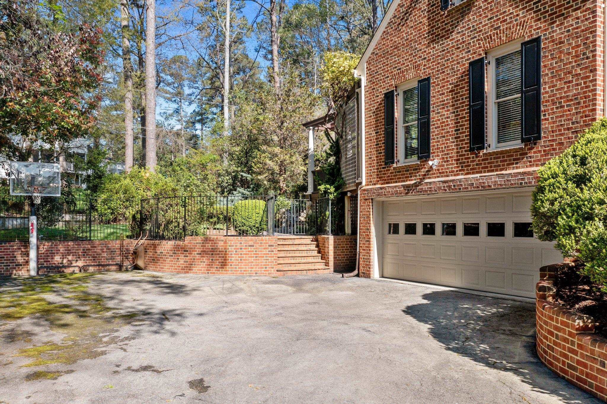 3608 Dover Road Durham, NC 27707 - Photo 5 of 58 a front view of a building with a yard and trees