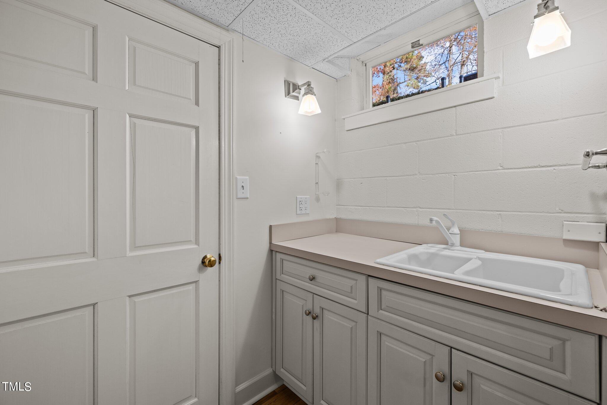3608 Dover Road Durham, NC 27707 - Photo 55 of 58 a bathroom with a sink and a mirror