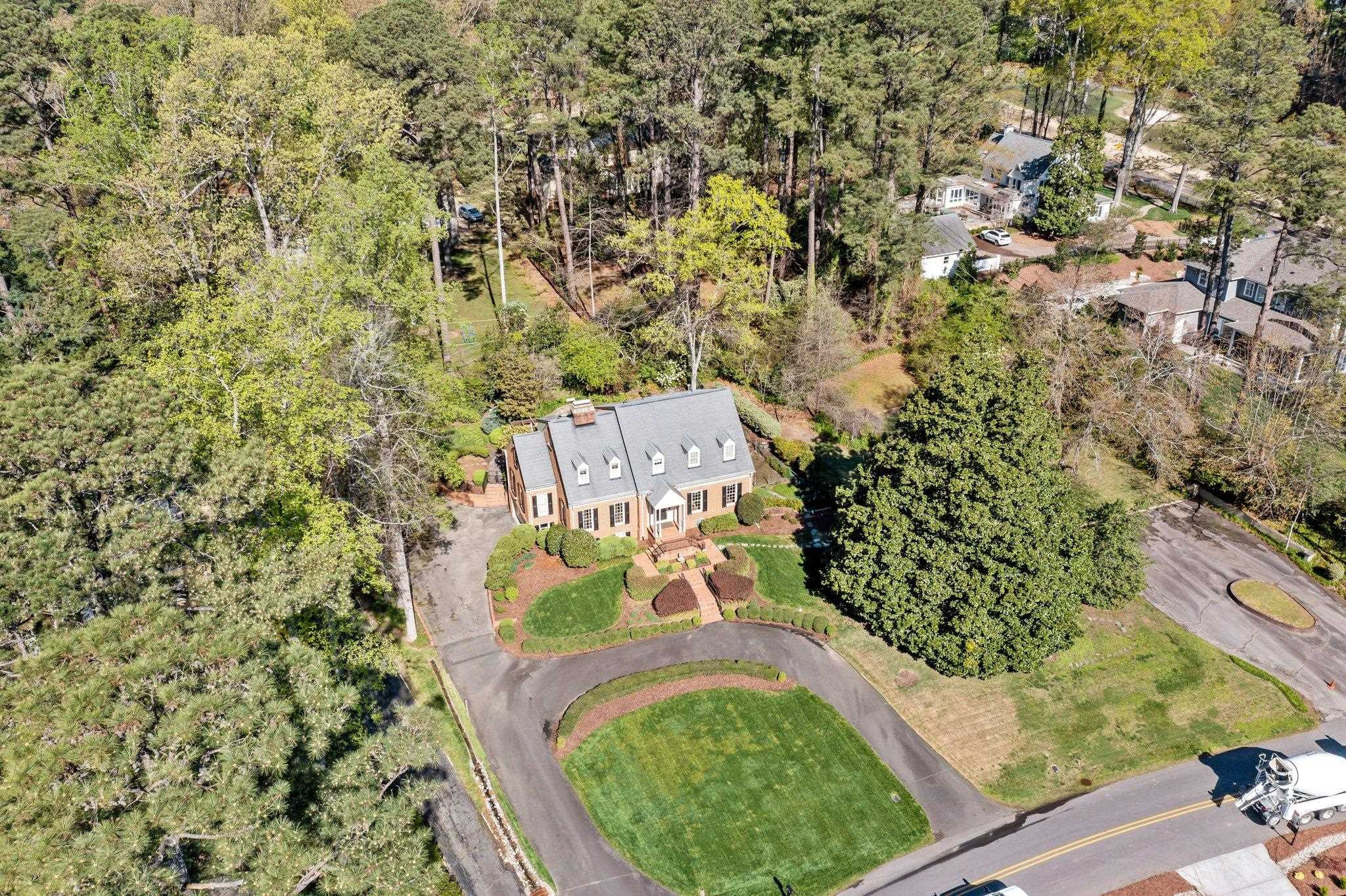 3608 Dover Road Durham, NC 27707 - Photo 9 of 58 view of a wooden house with a yard and large trees