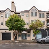 a front view of a house with a parking area