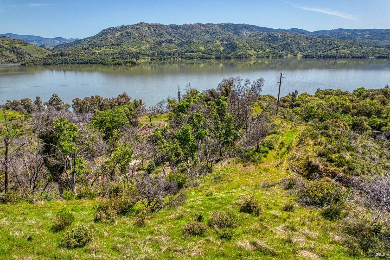 5851 Lake Ridge Road Ukiah, CA 95482 - Photo 12 of 17 a view of a lake with a mountain view