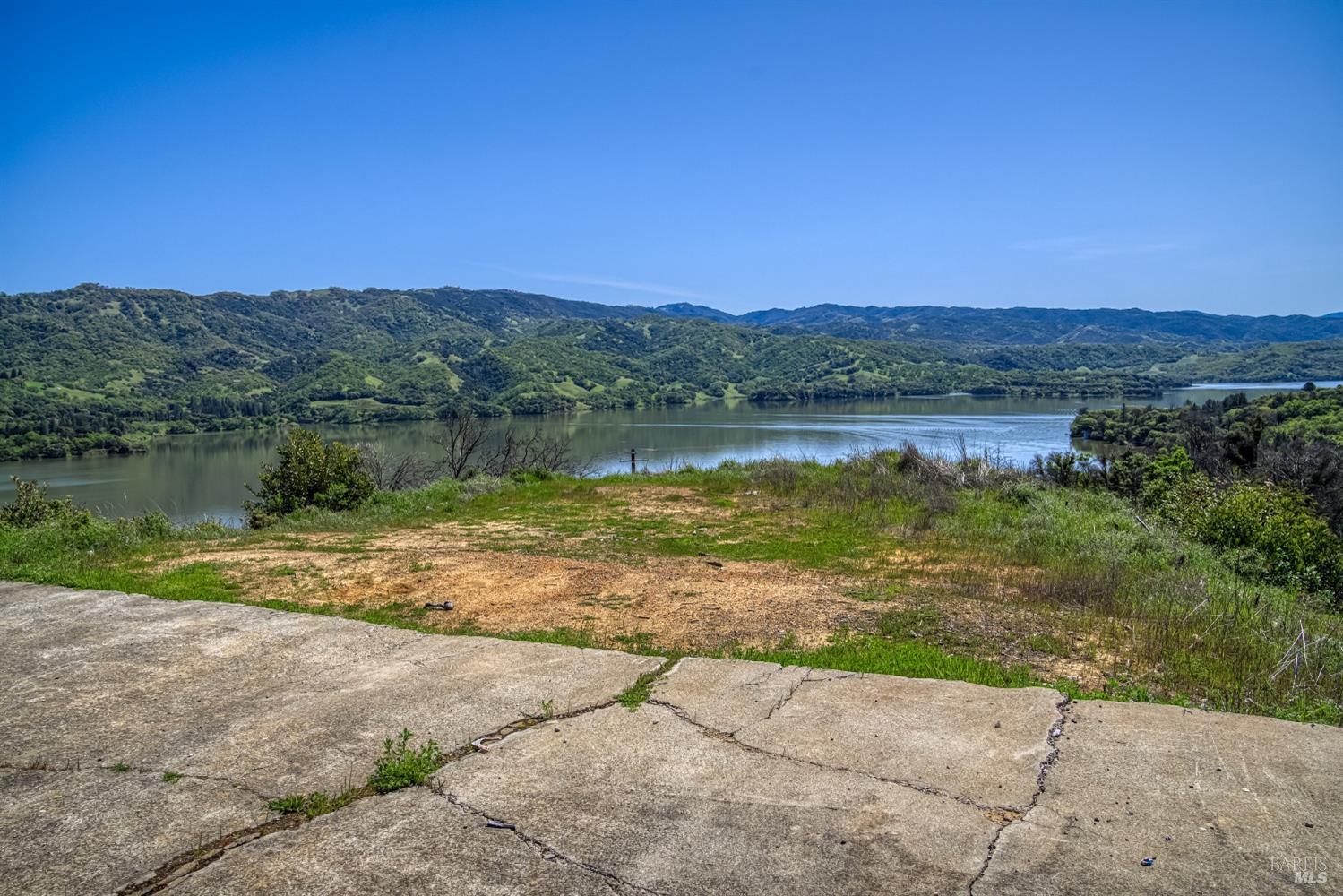 5851 Lake Ridge Road Ukiah, CA 95482 - Photo 2 of 17 a view of a lake with a yard