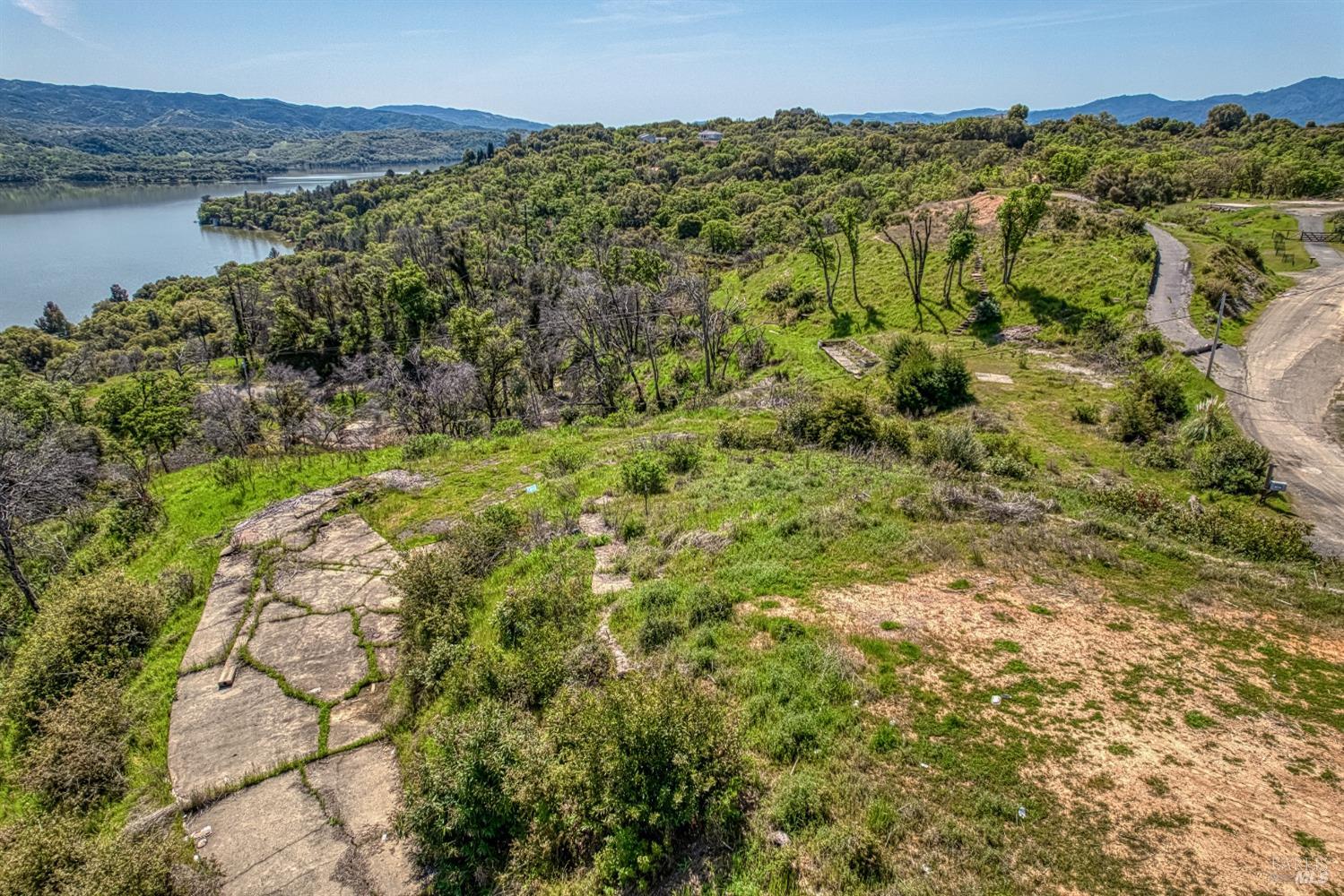5851 Lake Ridge Road Ukiah, CA 95482 - Photo 7 of 17 a view of a lake with a mountain in the background