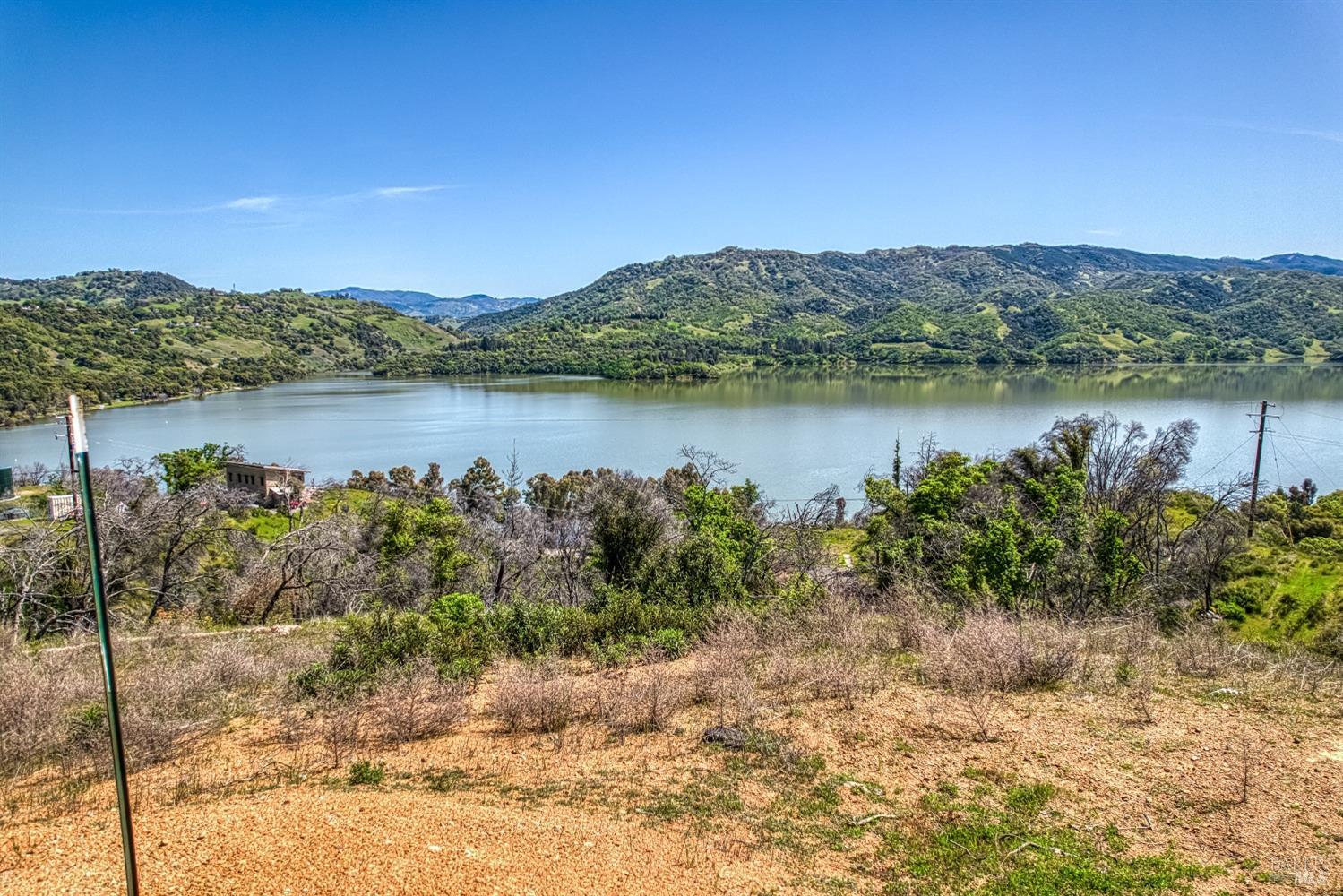 5851 Lake Ridge Road Ukiah, CA 95482 - Photo 8 of 17 a view of a lake with a mountain in the background
