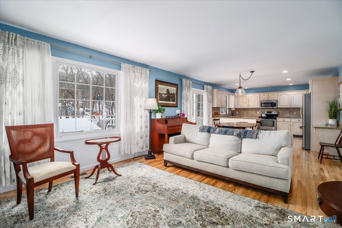 52 Key Rock Road Newtown, CT 06470 - Photo 11 of 40 a living room with furniture and a large window