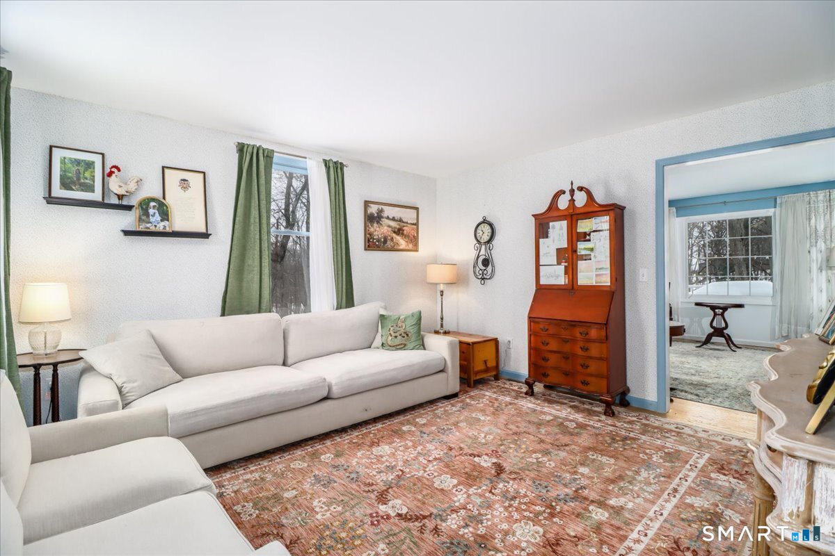 52 Key Rock Road Newtown, CT 06470 - Photo 12 of 40 a living room with furniture and a flat screen tv