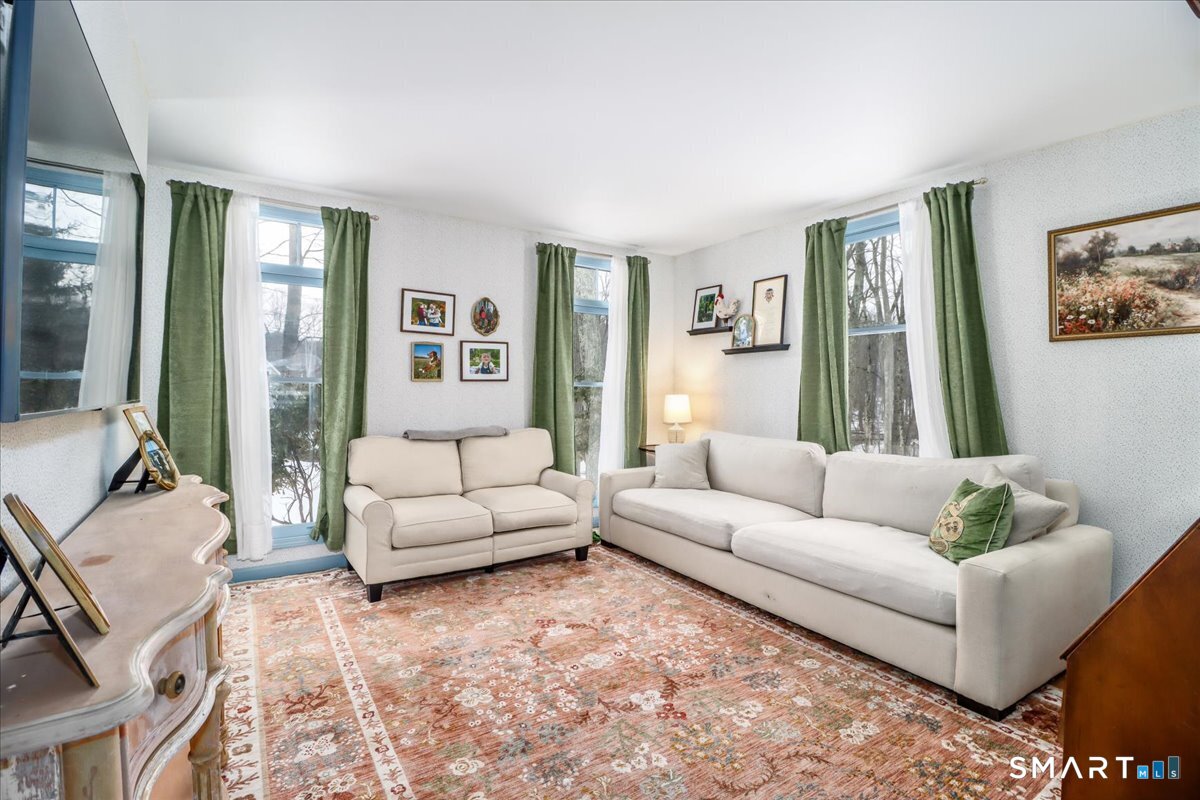 52 Key Rock Road Newtown, CT 06470 - Photo 13 of 40 a living room with furniture and a large window