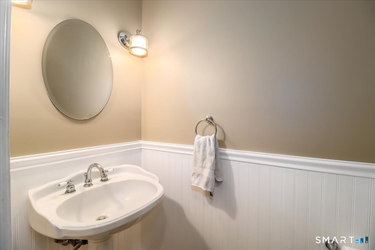 52 Key Rock Road Newtown, CT 06470 - Photo 18 of 40 a bathroom with a sink and a mirror