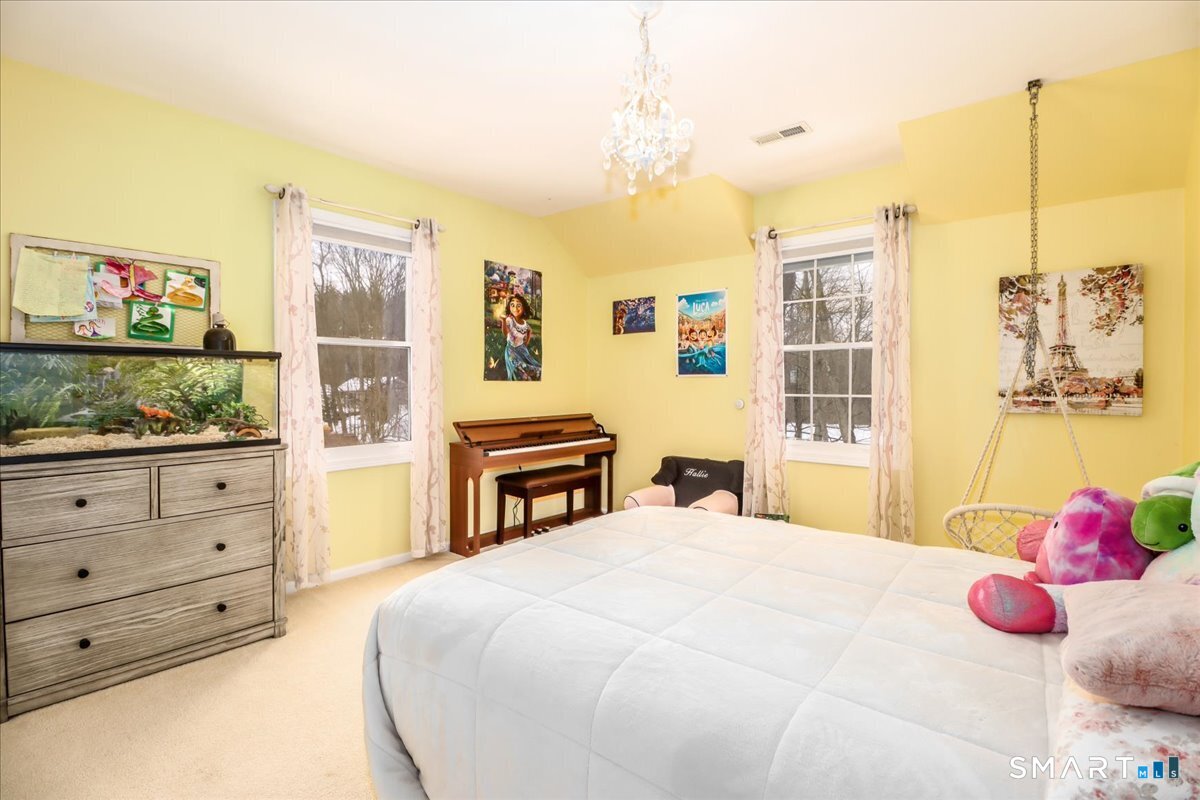 52 Key Rock Road Newtown, CT 06470 - Photo 23 of 40 a bedroom with a bed dresser and a window