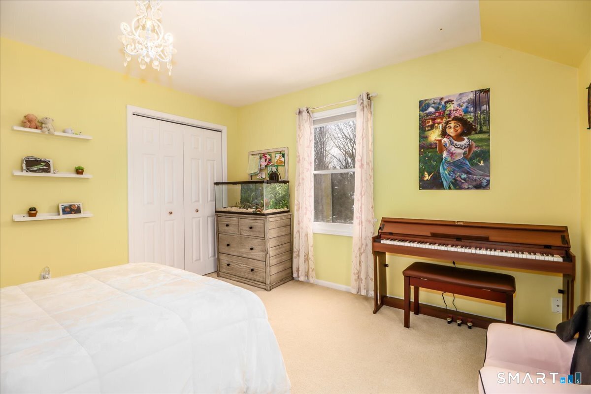 52 Key Rock Road Newtown, CT 06470 - Photo 24 of 40 a bedroom with a bed and a dresser