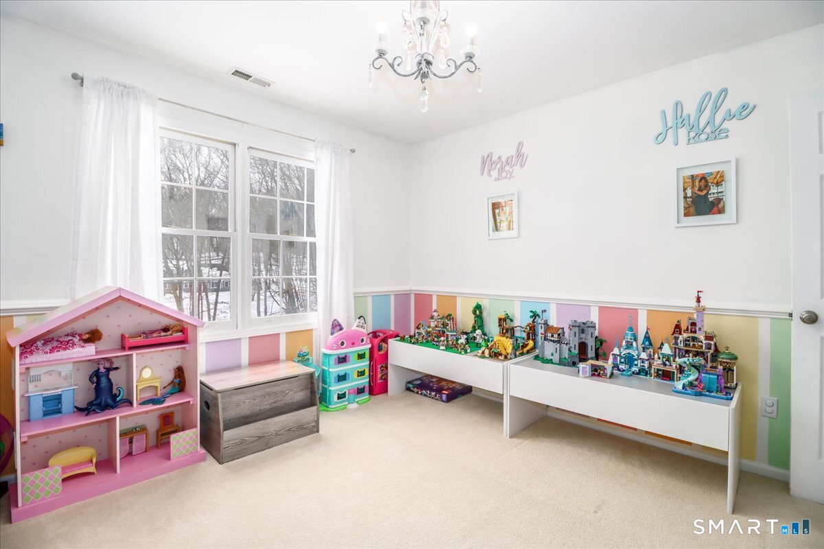 52 Key Rock Road Newtown, CT 06470 - Photo 28 of 40 a bed room with furniture and book shelf