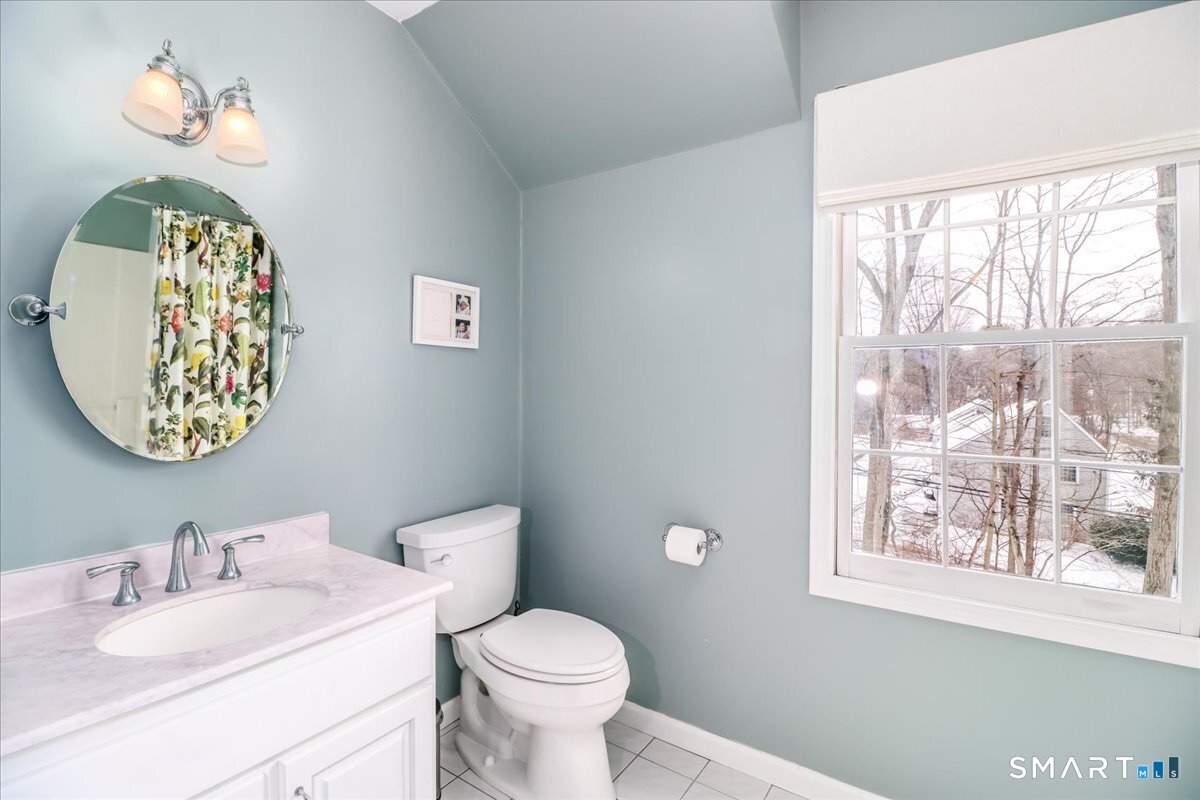 52 Key Rock Road Newtown, CT 06470 - Photo 29 of 40 a bathroom with a toilet a sink and a mirror