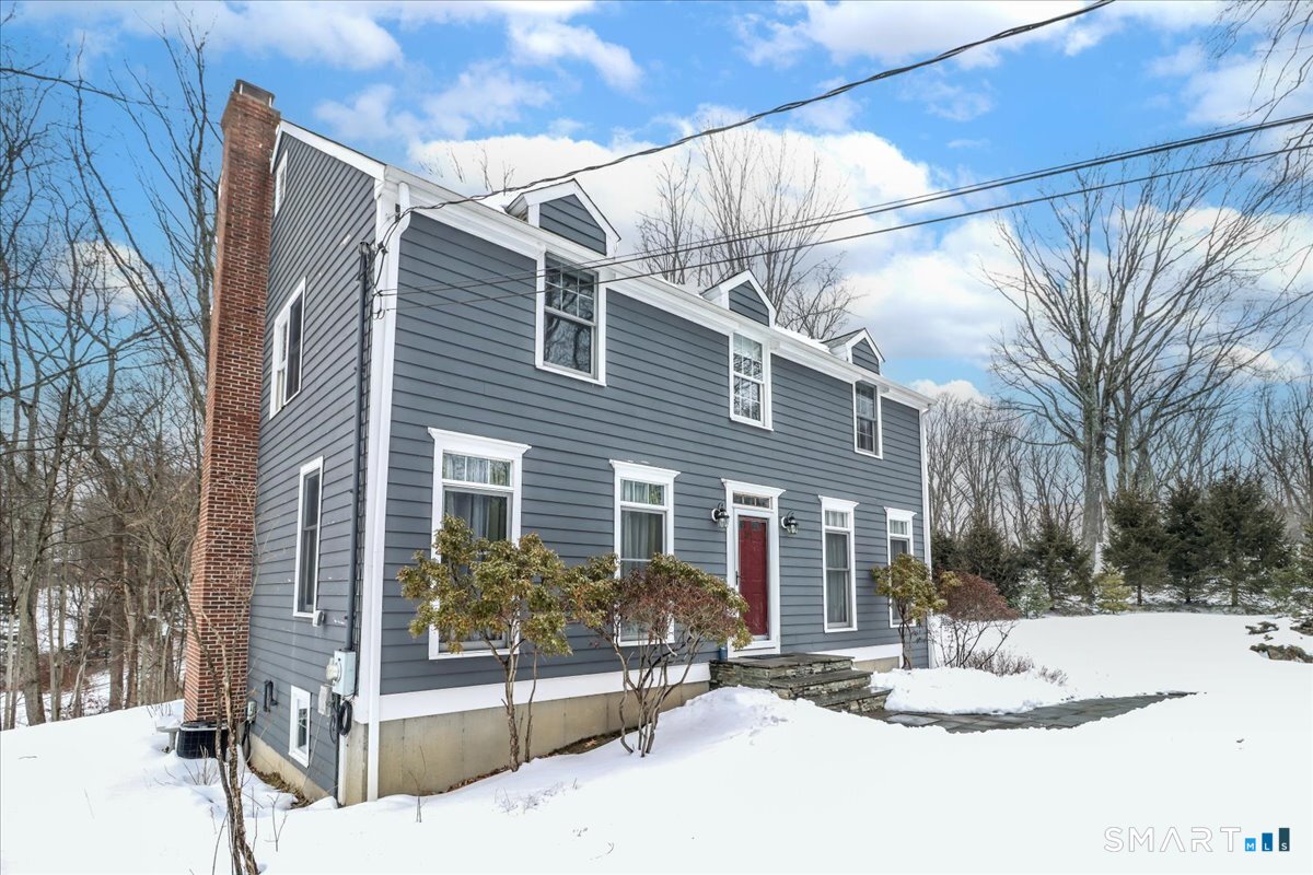 52 Key Rock Road Newtown, CT 06470 - Photo 36 of 40 a view of a house with a snow in the yard