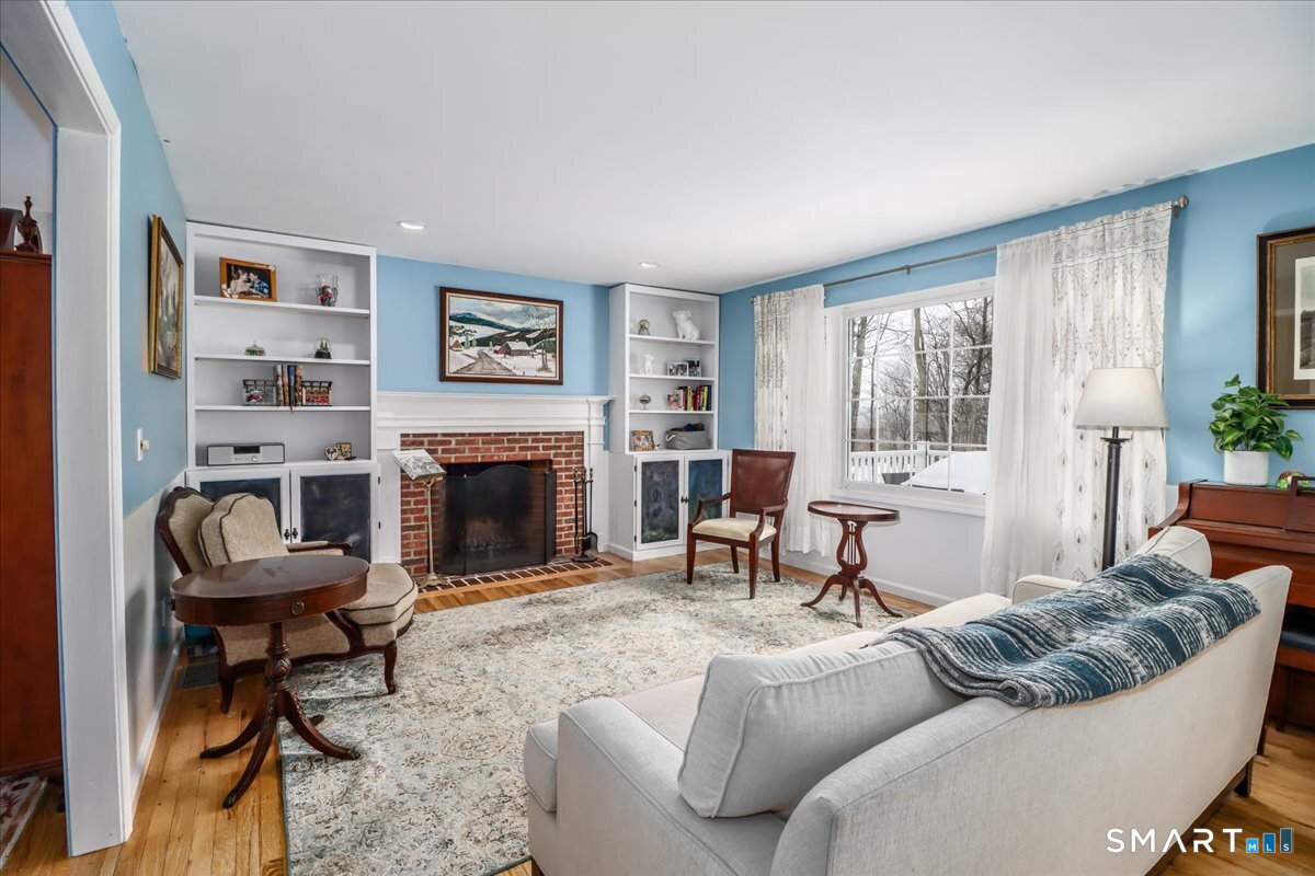 52 Key Rock Road Newtown, CT 06470 - Photo 8 of 40 a living room with furniture and a fireplace
