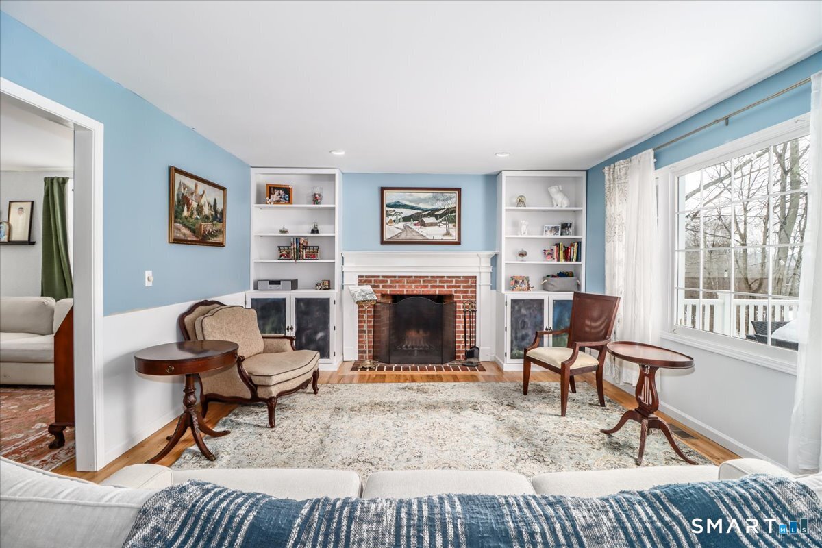 52 Key Rock Road Newtown, CT 06470 - Photo 9 of 40 a living room with furniture and a fireplace