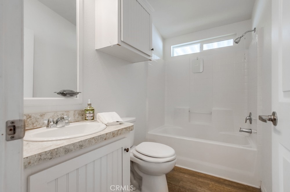 3909 Reche Road, Unit 185 Fallbrook, CA 92028 - Photo 12 of 22 a bathroom with a sink toilet vanity and shower