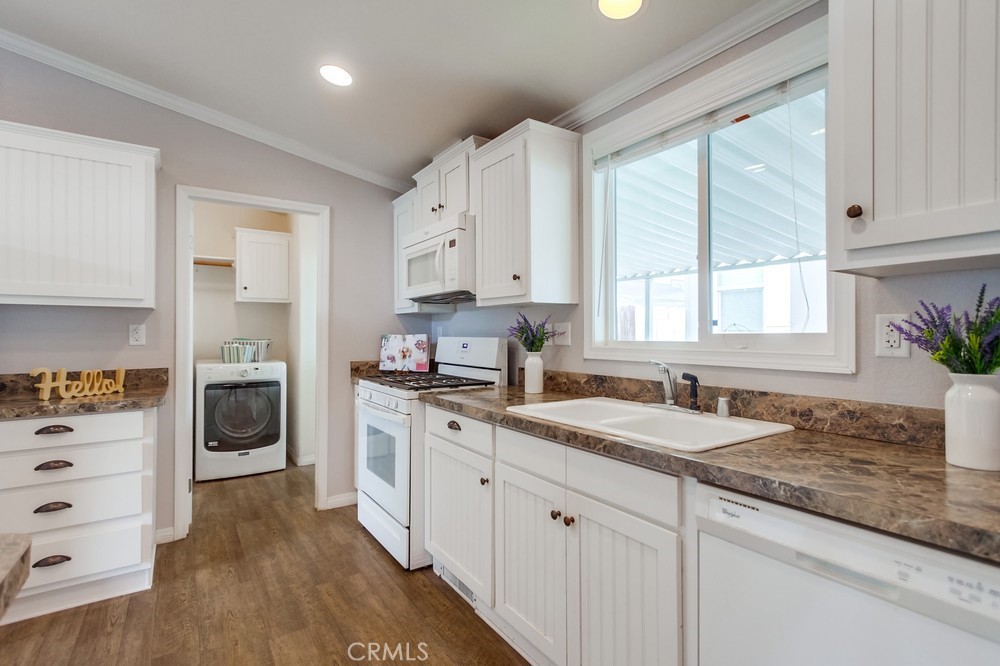 3909 Reche Road, Unit 185 Fallbrook, CA 92028 - Photo 16 of 22 a kitchen with granite countertop a sink stainless steel appliances and cabinets