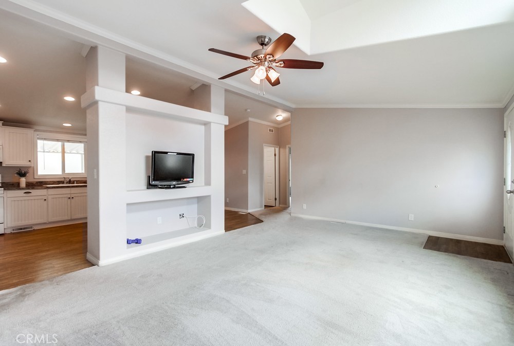 3909 Reche Road, Unit 185 Fallbrook, CA 92028 - Photo 20 of 22 a view of an empty room and a flat screen tv