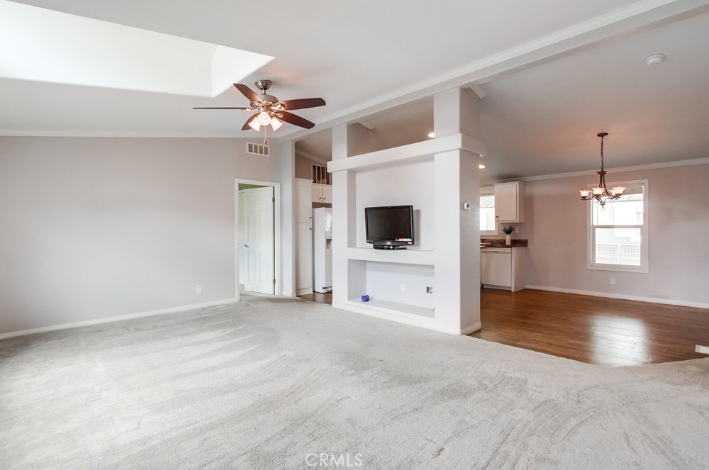 3909 Reche Road, Unit 185 Fallbrook, CA 92028 - Photo 21 of 22 a view of a livingroom with a flat screen tv