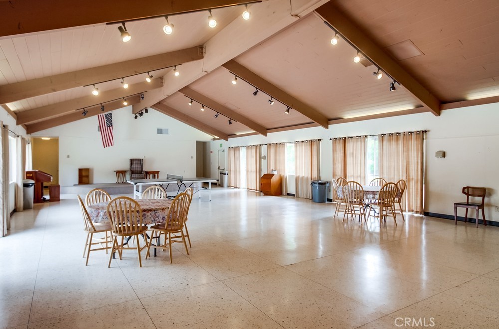 3909 Reche Road, Unit 185 Fallbrook, CA 92028 - Photo 9 of 22 a dining room with furniture entryway and wooden floor