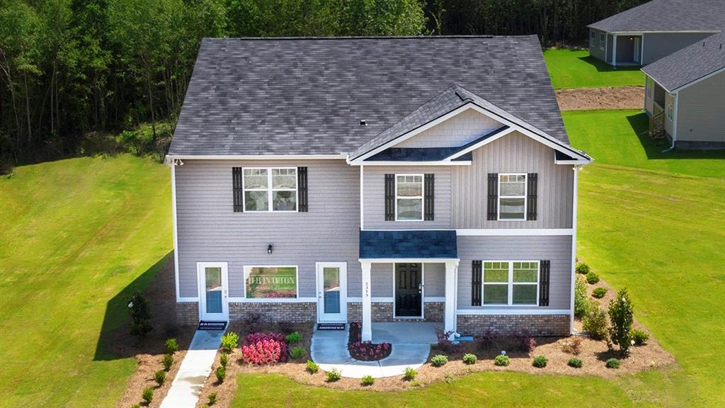 134 Ralph Still Road Dacula, GA 30019 - Photo 1 of 1 front view of house with a yard