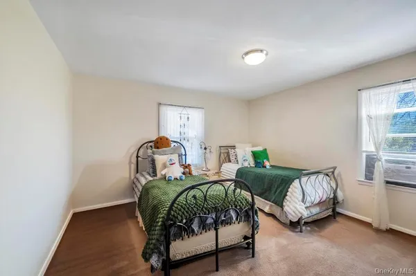 a bedroom with furniture and a window