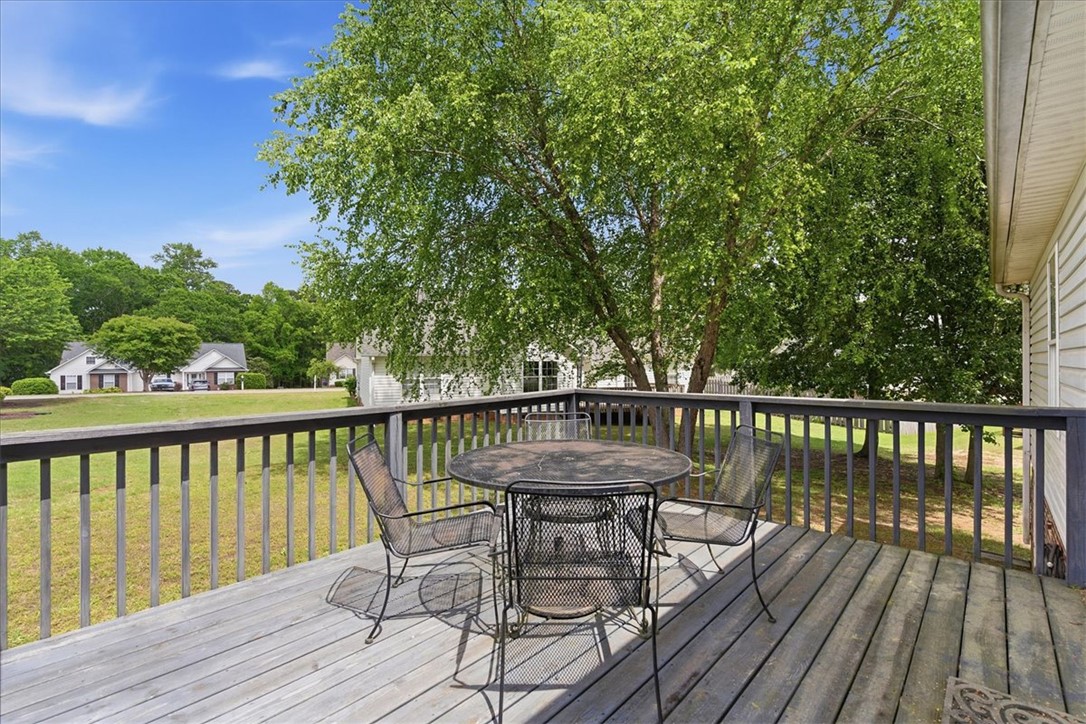 166 Amberwood Drive Anderson, SC 29621 - Photo 8 of 38 Enjoy outdoor living on this expansive wooden deck, perfect for relaxation and entertaining.