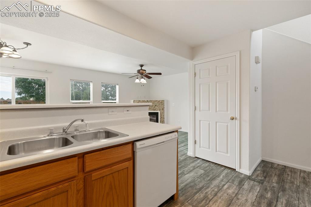 5679 Sunshade Point Colorado Springs, CO 80923 - Photo 11 of 30 a kitchen with a sink and cabinets