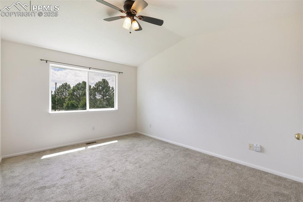 5679 Sunshade Point Colorado Springs, CO 80923 - Photo 12 of 30 an empty room with a window