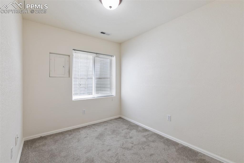 5679 Sunshade Point Colorado Springs, CO 80923 - Photo 21 of 30 an empty room with a window