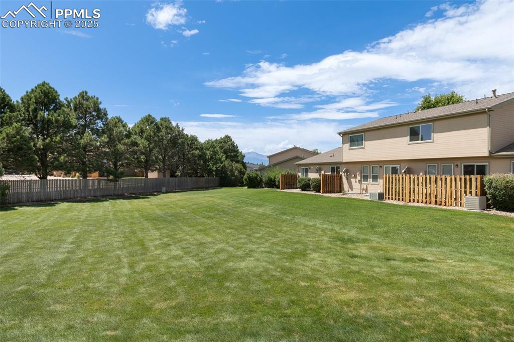 5679 Sunshade Point Colorado Springs, CO 80923 - Photo 29 of 30 a view of a house with backyard and sitting area