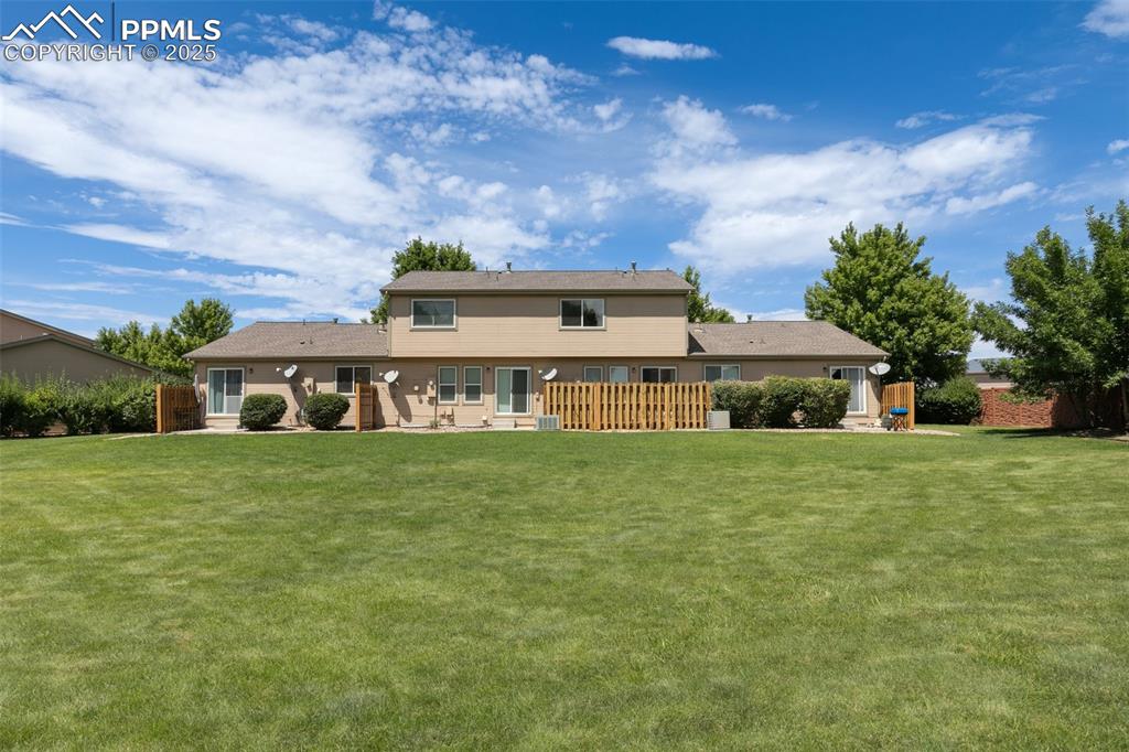 5679 Sunshade Point Colorado Springs, CO 80923 - Photo 30 of 30 a front view of a house with garden