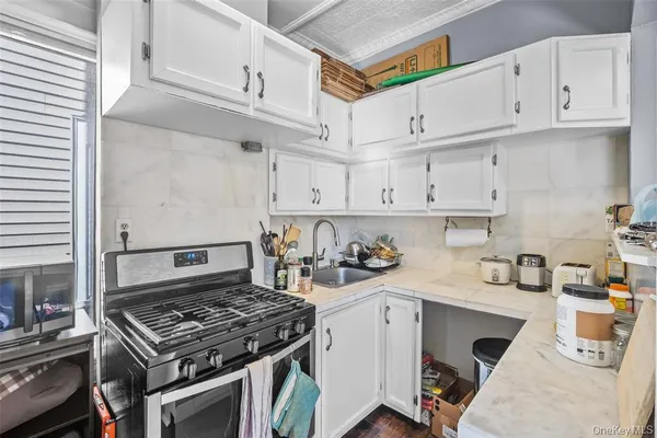 a kitchen with cabinets and appliances
