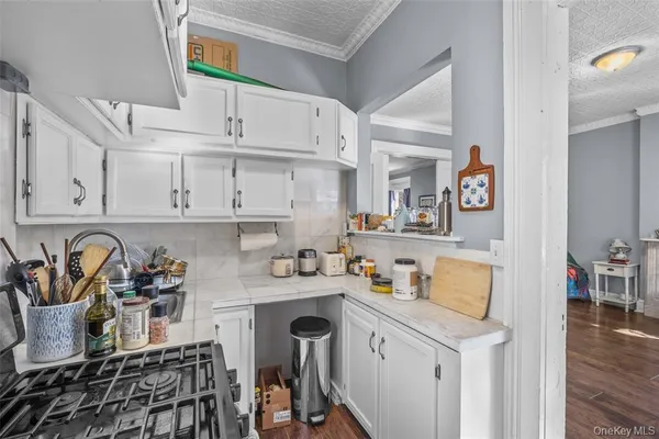a kitchen with stainless steel appliances a sink a stove and cabinets