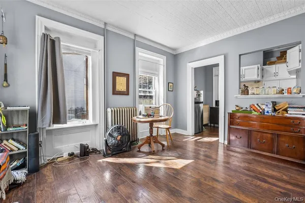 a view of a livingroom with furniture and a window