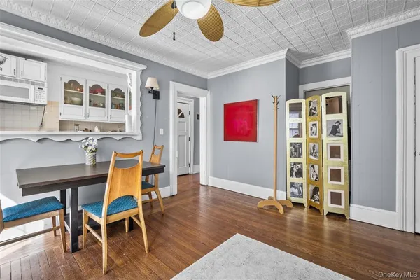 a workspace with furniture wooden floor and window