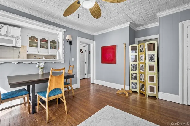 a workspace with furniture wooden floor and window