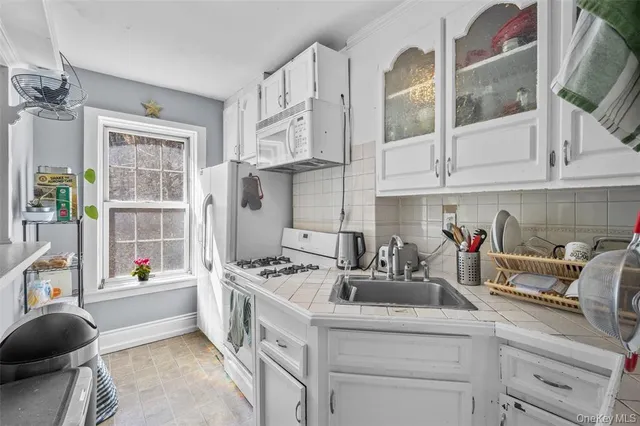 a kitchen with stainless steel appliances kitchen island granite countertop a sink and cabinets