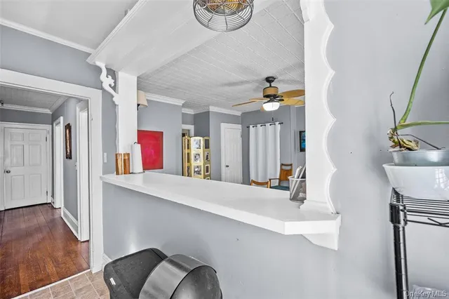 a view of living room with furniture and wooden floor